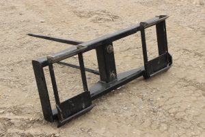 Skidsteer mount round bale fork for sale in Lethbridge, Alberta. Skid steer mount round bale fork available at Hanlon Ag Centre.