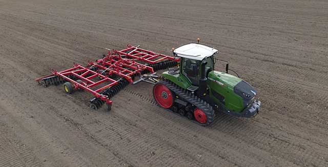 Fendt 943MT Tracked tractor in field pulling Sunflower disc