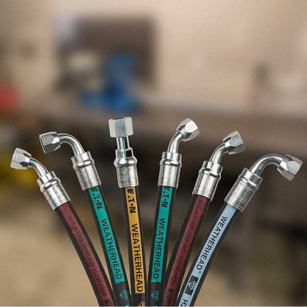 Close-up of hydraulic hose fittings for tractors and farm equipment, displayed by Hanlon Ag Centre in southern Alberta, highlighting replacement parts and maintenance supplies for agricultural machinery.