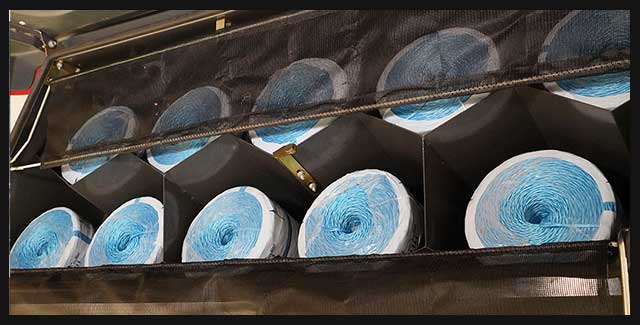 Interior view of a farm equipment air filtration system with multiple blue filter cartridges installed, showing advanced engine protection and clean airflow on agricultural machinery available at Hanlon Ag Centre in southern Alberta. Demonstrating AGCO parts available at Hanlon Ag Centre.