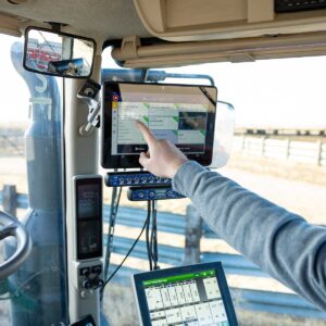 What Trimble CenterPoint RTX looks like in a tractor cab—high-accuracy GPS guidance system used by Southern Alberta farmers for precision agriculture
